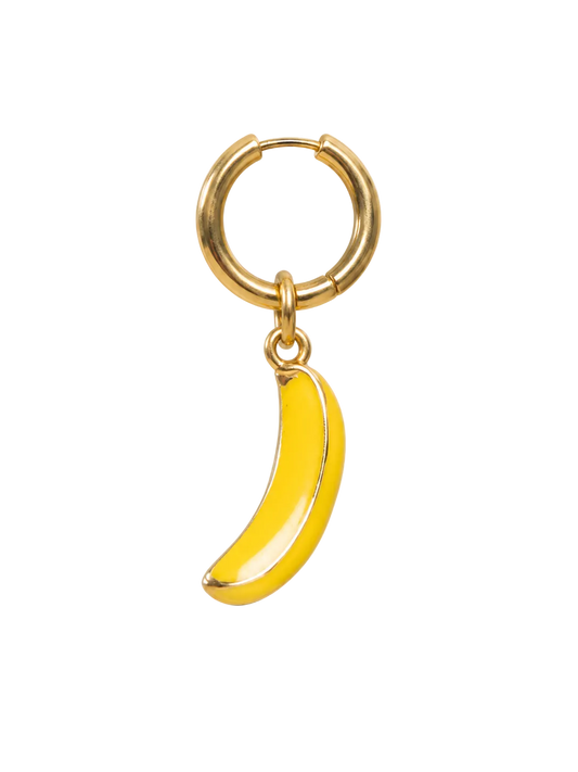 A gold huggie hoop earring with a dangling yellow banana charm, shown on a plain white background.
