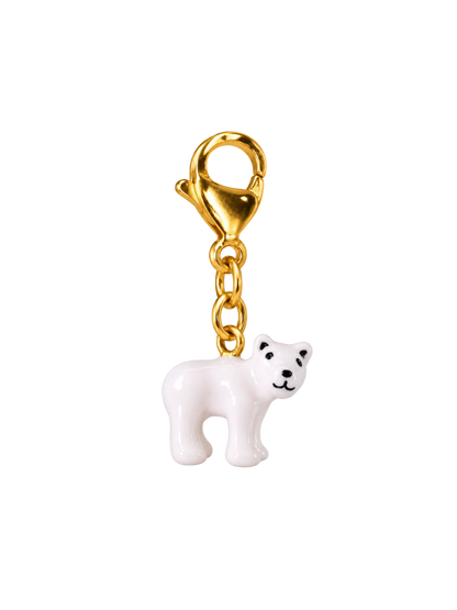 A gold-tone lobster clasp keychain featuring a small white polar bear charm with black facial details, shown against a plain white background.