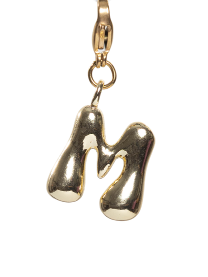 Gold plated letter M charm stainless steel clasp on a white background