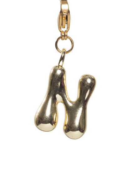 Gold plated letter N charm stainless steel clasp on a white background