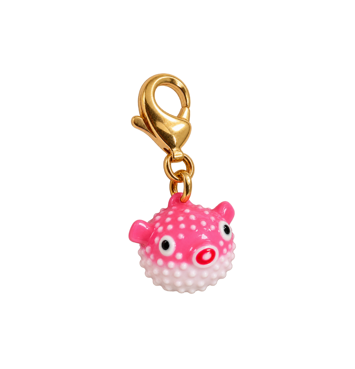 A pink puffer fish charm with white polka dots, black eyes, and a red nose, attached to a gold lobster clasp, shown on a plain white background.