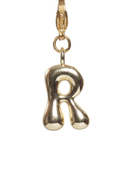 Gold plated letter R charm stainless steel clasp on a white background