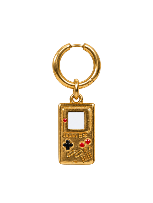 A gold-colored millie madness handheld game console keychain charm with a split ring, featuring red, black, and white details on a plain white background.