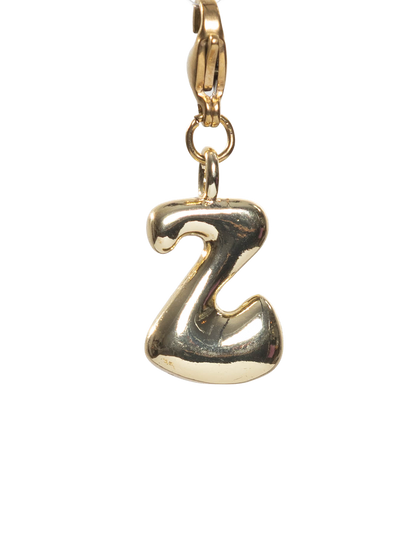 Gold charm with letter 'Z' on a white background